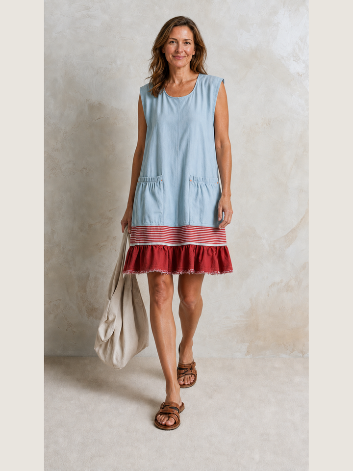 Powder-blue Bennett and Lowe Hazel ruffle hem tunic dress displayed on a model showing its stylish silhouette and flowy fabric.