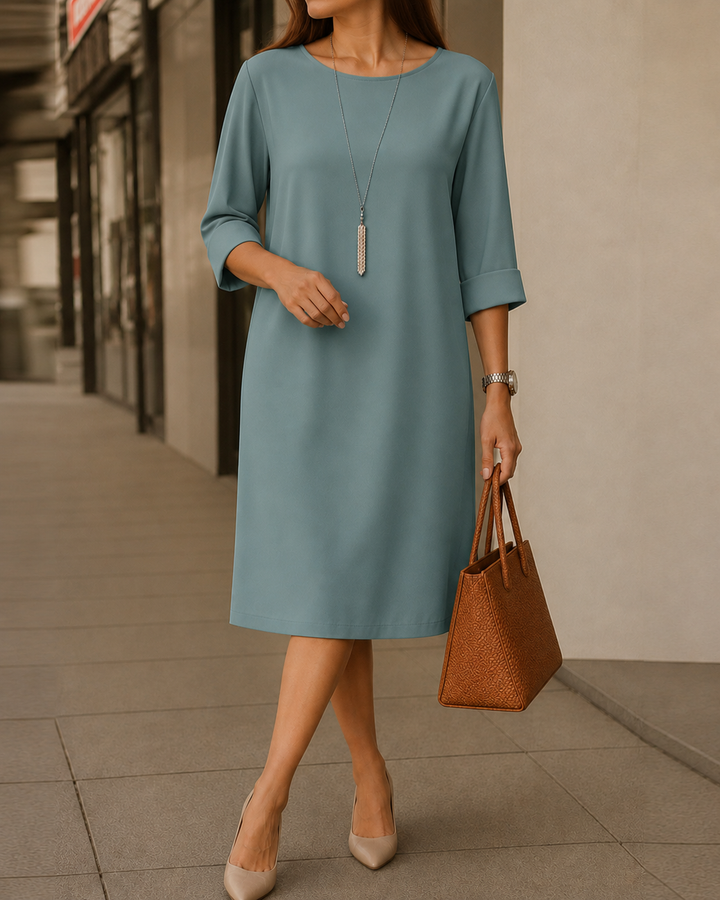 Odette Tummy-Contouring Midi Dress by Bennett and Lowe, featuring a fitted silhouette and elegant design, displayed on a hanger.