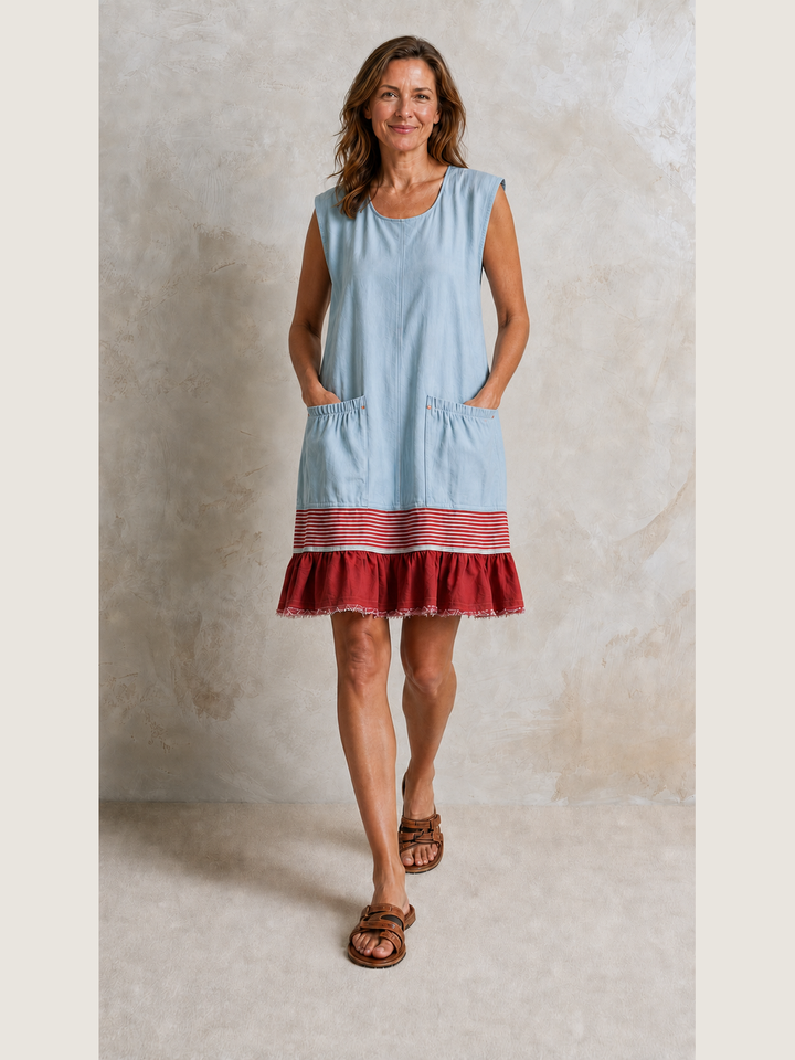 Powder blue Hazel ruffle hem tunic dress by Bennett and Lowe with hand pockets, displayed flat on a white background.