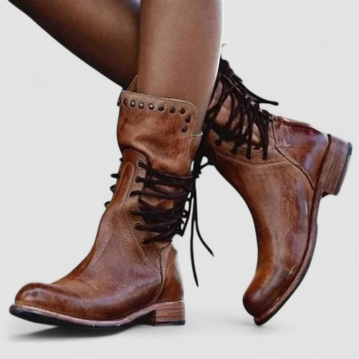Black lace-up ankle boot for women by Bennett and Lowe, featuring a stylish leather design and sturdy sole.