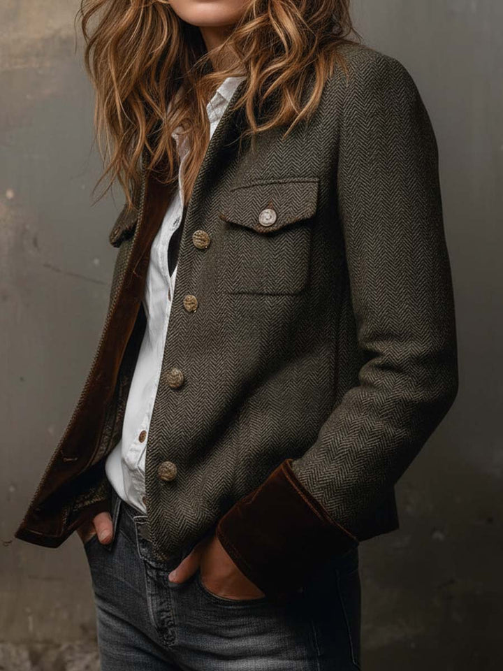 Bennett and Lowe Barbara herringbone contrast-trim blazer jacket displayed on a hanger, showcasing tailored fit and stylish lapel details.