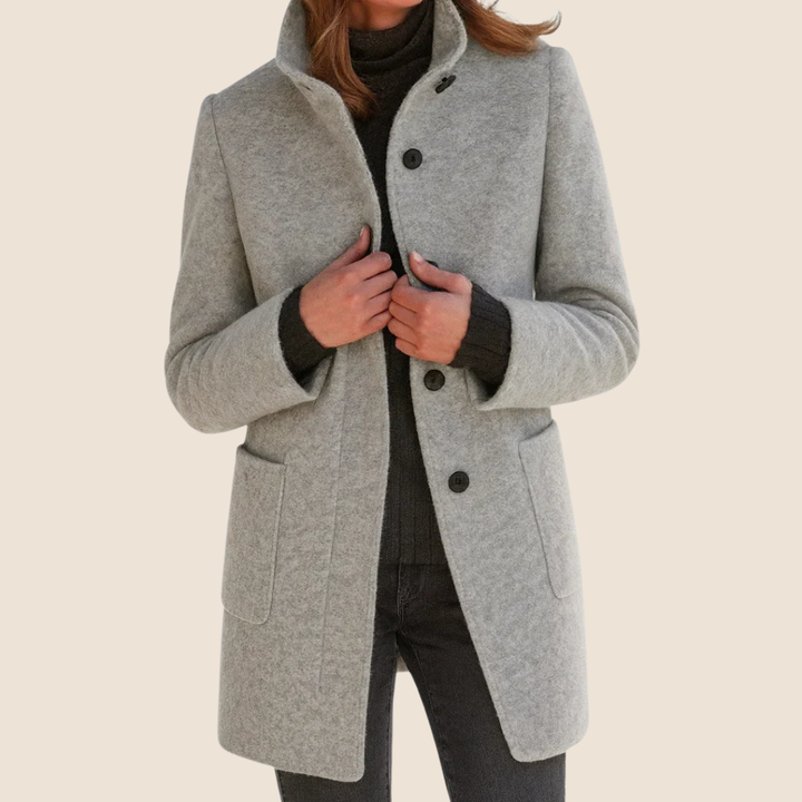 Bennett and Lowe Eleonora women's tailored midi coat with button-front closure, showcasing a sleek, structured design in the image.