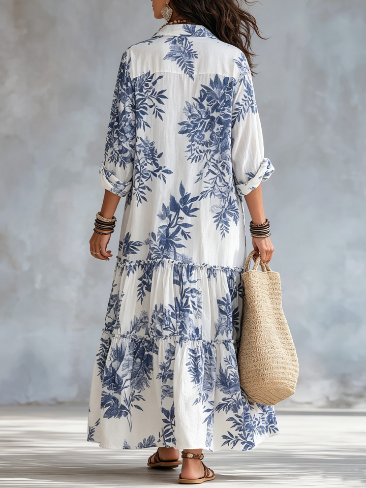 Blue floral button-down maxi dress for women from Bennett and Lowe, featuring a flowing silhouette and vibrant floral pattern.