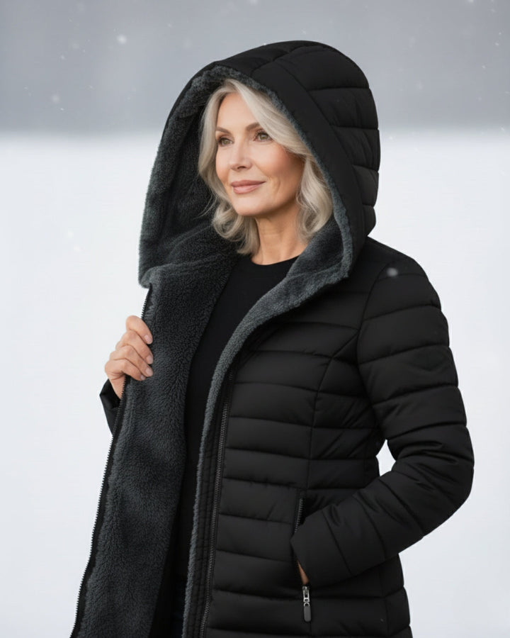Bennett and Lowe Marguerite hooded quilted winter jacket in dark navy with front zipper and cozy hood, suitable for cold weather.