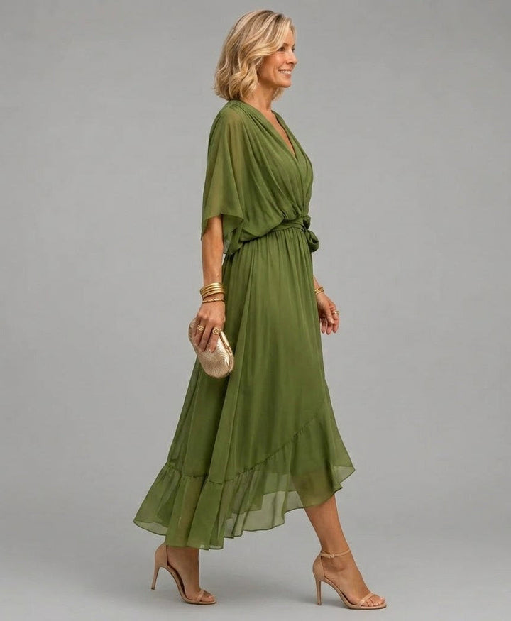 Clara wrap V-neck dress by Bennett and Lowe featuring a fitted waist and flowing fabric in a stylish, elegant design.