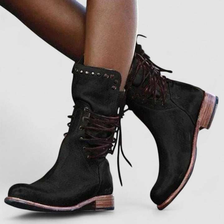 Bennett and Lowe Mae lace-up ankle boots for women, showcasing black leather with ankle-high design and sturdy heel.