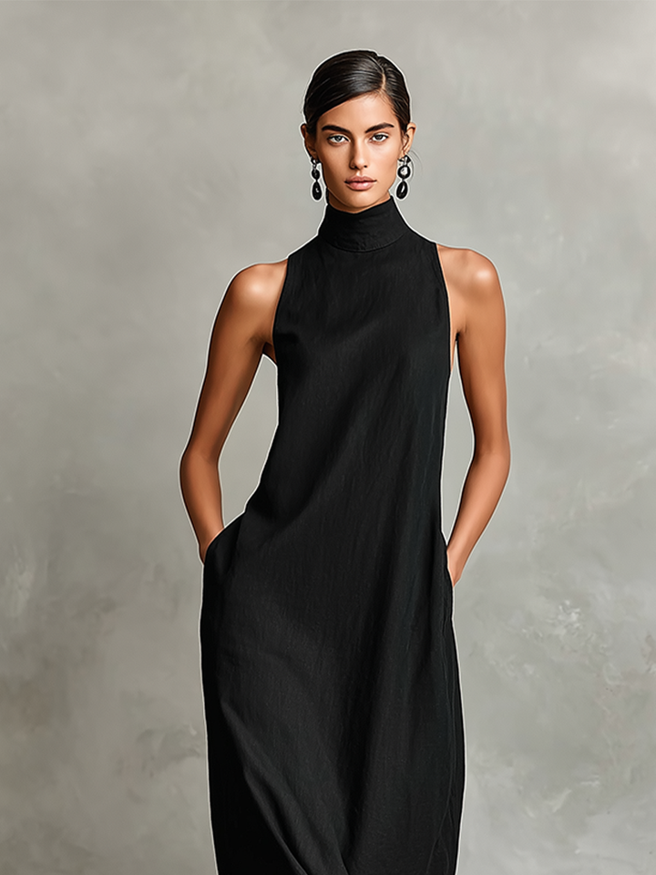 Chrissy high-neck pocket maxi dress by Bennett and Lowe, shown in a flowing fabric with side pockets and a high neckline.