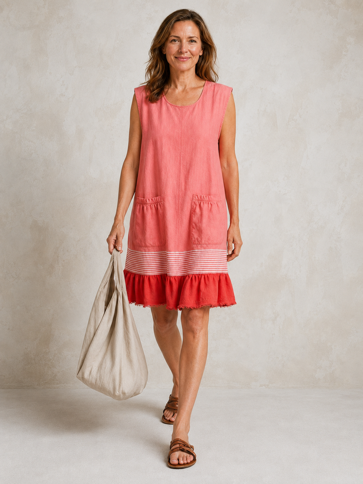 Hazel ruffle hem tunic dress by Bennett and Lowe, featuring a flowy silhouette and feminine ruffle details in natural fabric.