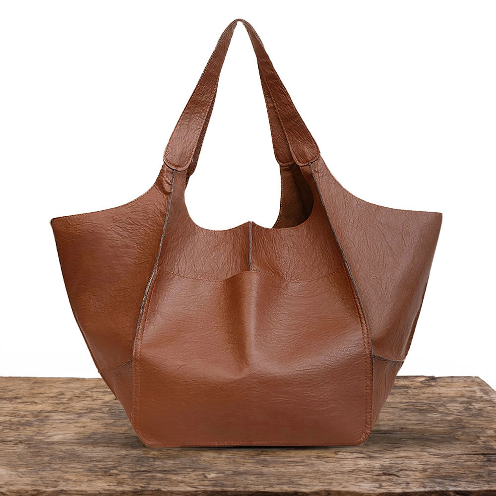 Bennett and Lowe Ruth tote bag in pebbled leather with adjustable strap, featuring a spacious design and durable handles.