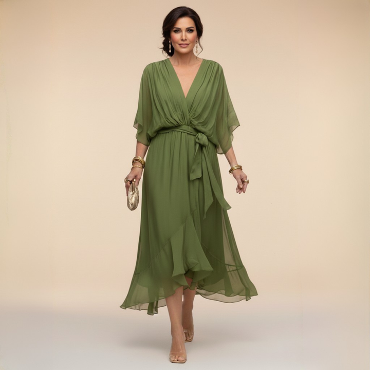 Clara wrap V-neck dress by Bennett and Lowe featuring a fitted waist and elegant drape, in a soft, flowing fabric.