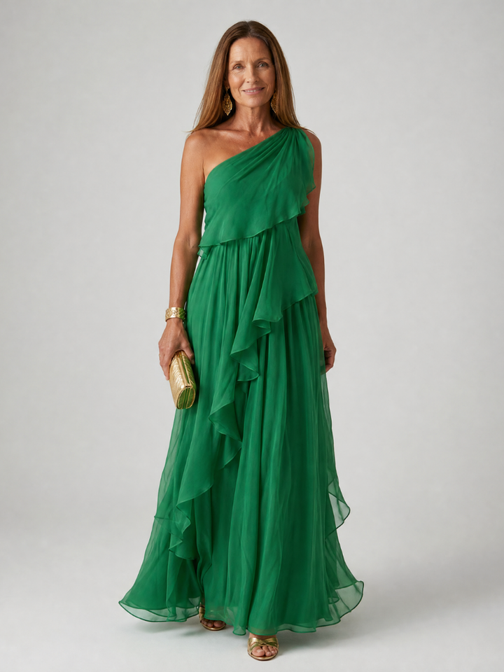 Tracey Bennett and Lowe one-shoulder ruffle maxi dress in flowing fabric, showcasing elegant design and layered ruffle details.