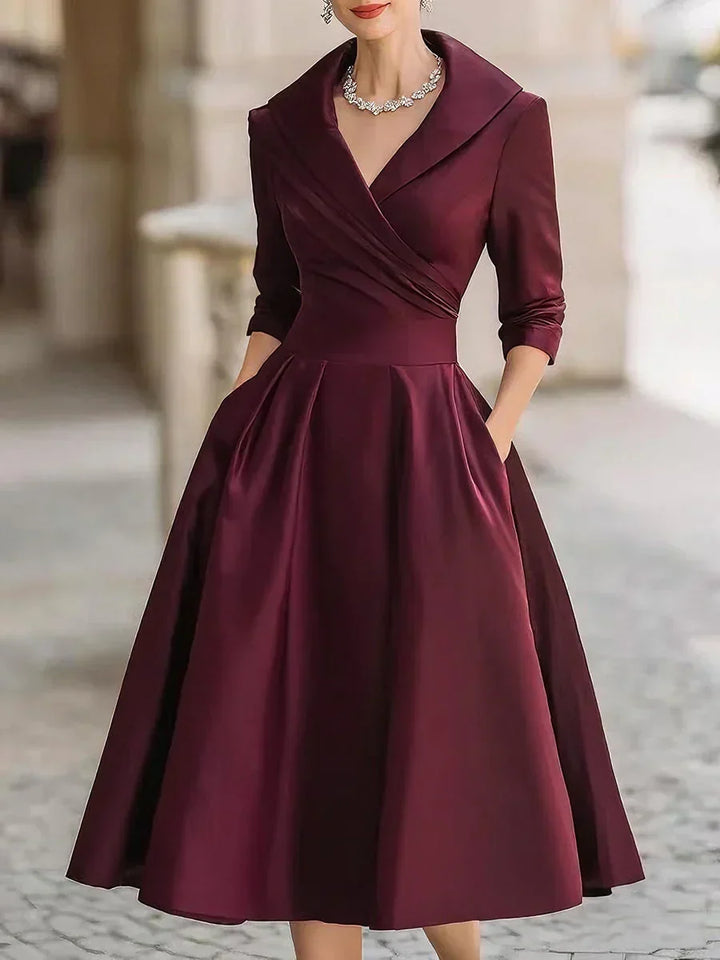 Karen satin wrap-bodice midi dress with collar and pockets for women by Bennett and Lowe, shown on a hanger.