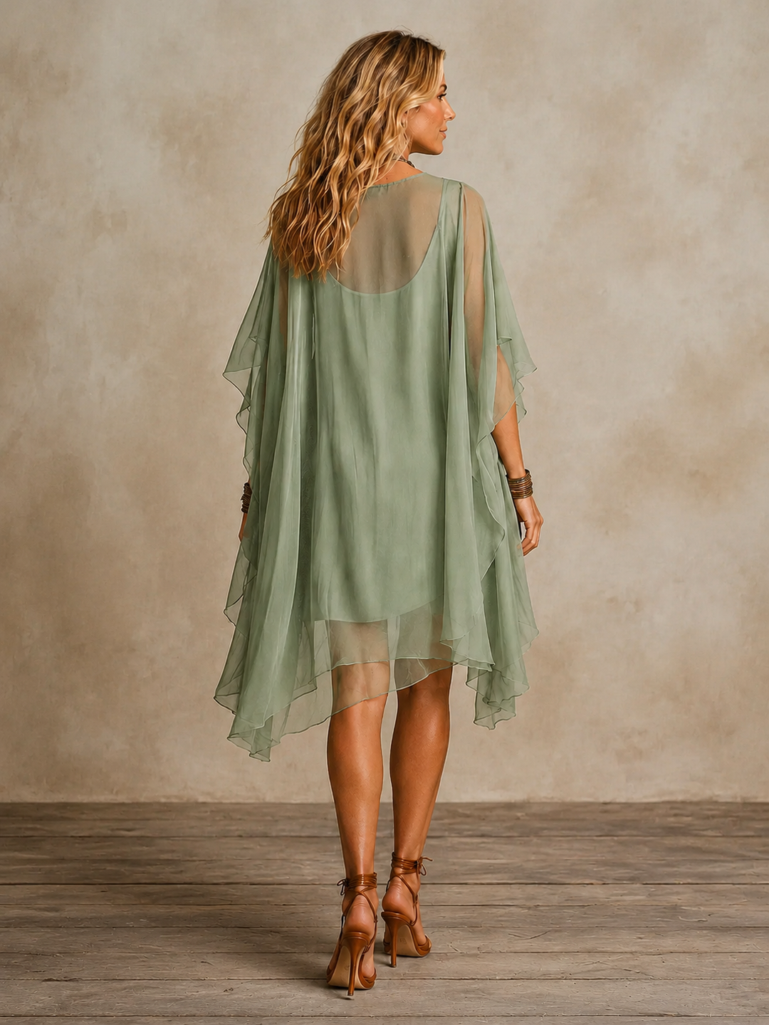 Olivia Newyork Ella tiered boho mini dress with flowy fabric and ruffled layers, perfect for casual or summer wear.