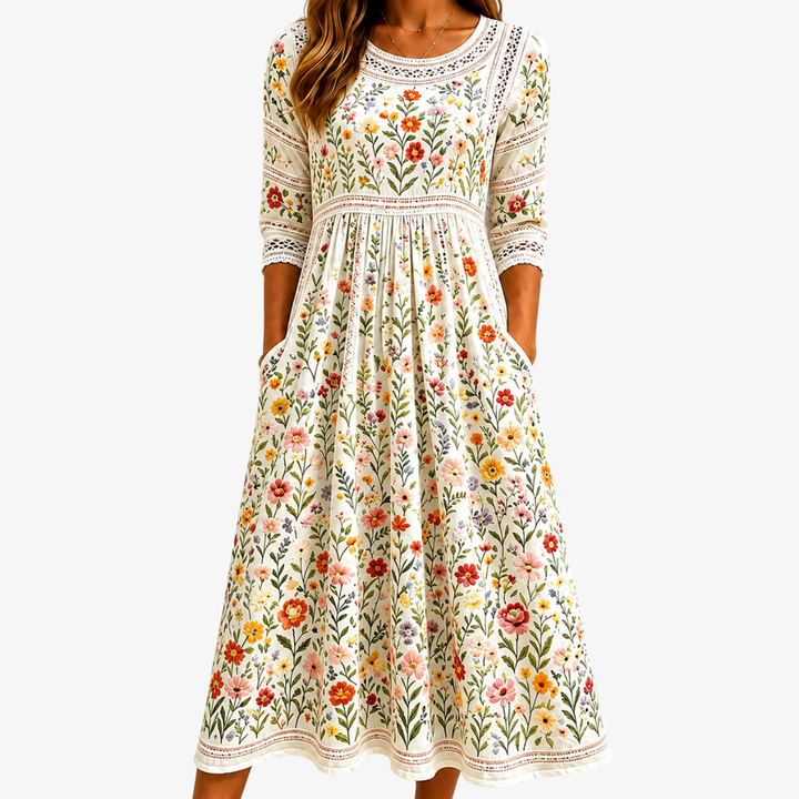 Bennett and Lowe Wildflower Meadow Charm Midi Dress featuring a floral print, sleeveless design, and flowing silhouette.