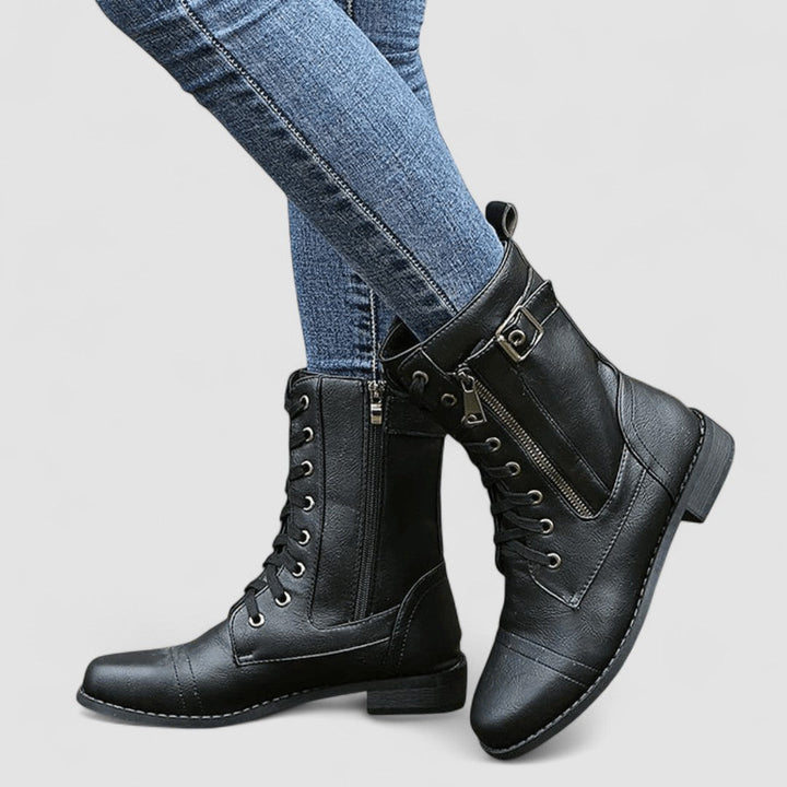 Bennett and Lowe Sylvia lace-up mid-calf women's boots in black leather with chunky heels and decorative stitching.