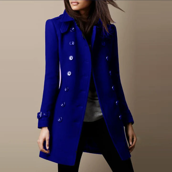 Longline Danielle trench coat by Bennett and Lowe featuring classic collar, button closure, and belted waist in a neutral fabric.