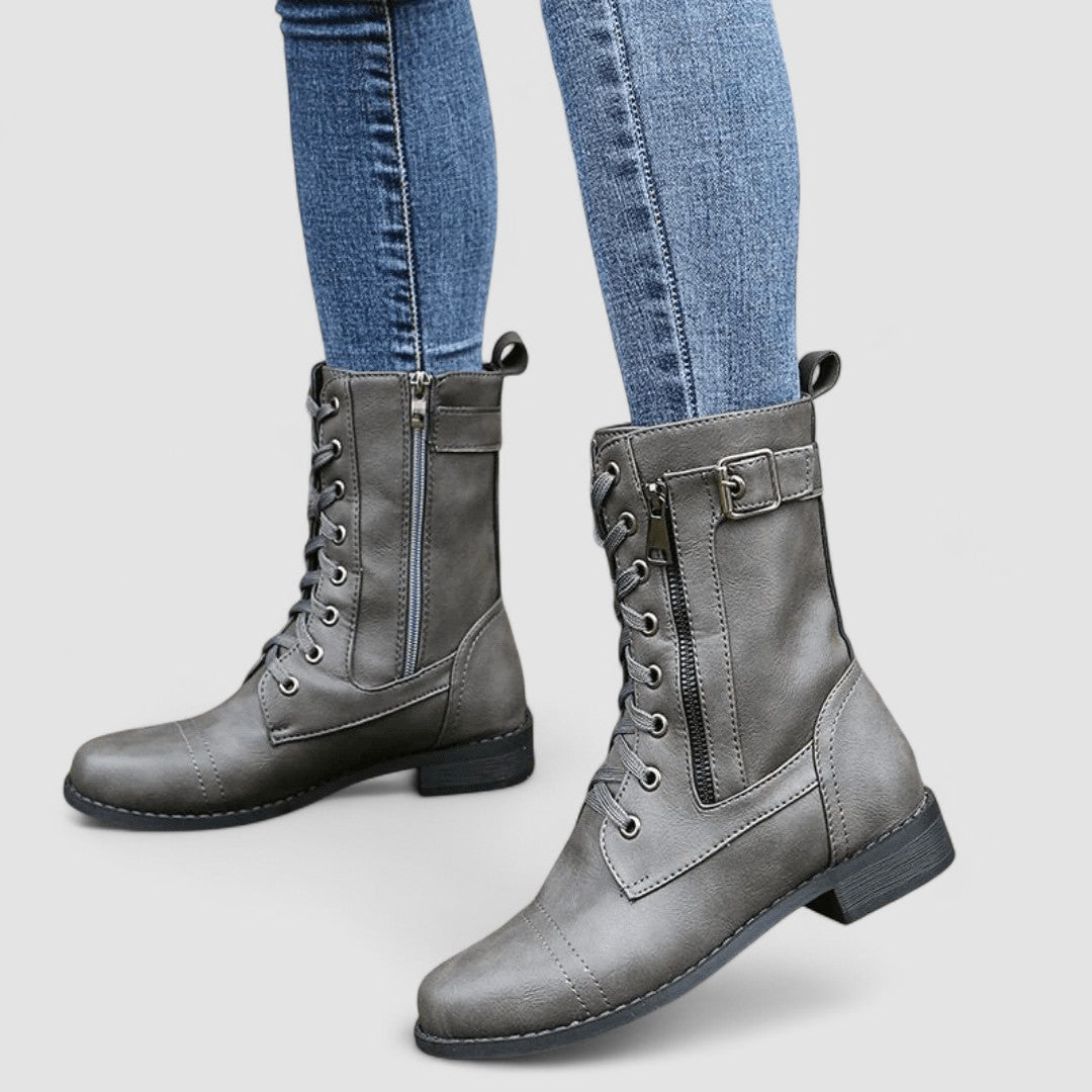 Bennett and Lowe Sylvia lace-up mid-calf women's boots in black leather with chunky heel and decorative stitching.