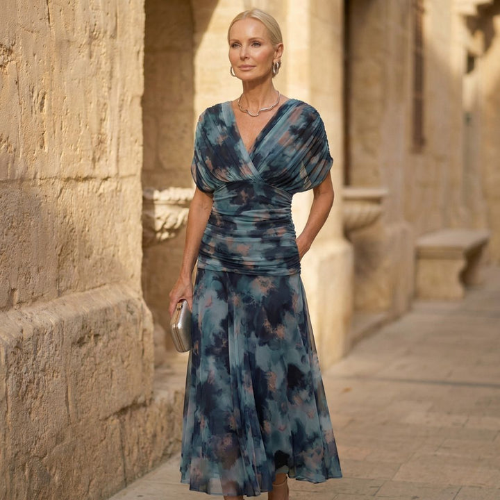 Elegant blue Luna vestidos signature dress by Bennett and Lowe, showcasing flowing fabric and stylish design.