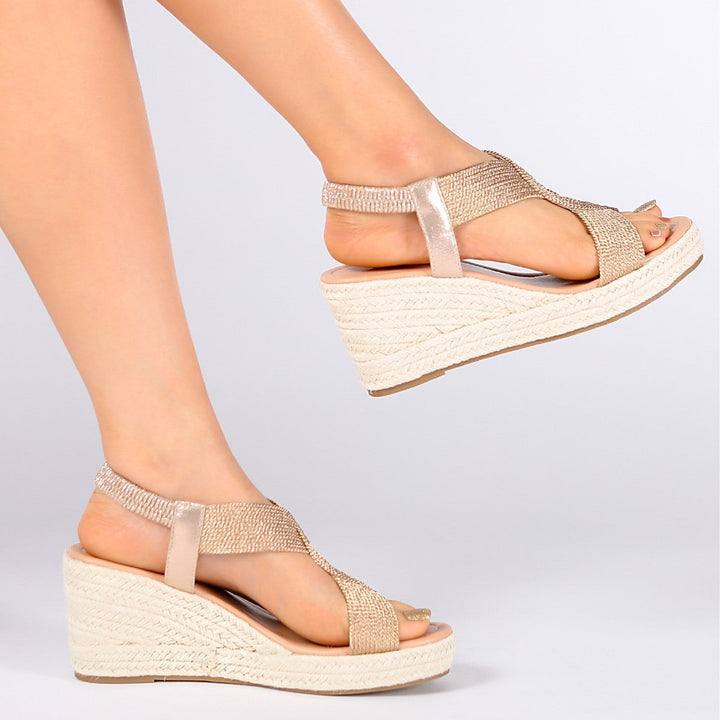 Handwoven Aroa wedge sandals by Bennett and Lowe featuring natural woven straps and a cork wedge heel.