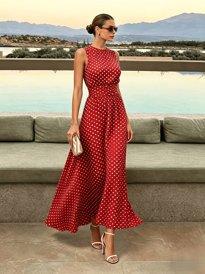 Bennett and Lowe Colleen polka dot maxi dress with long sleeves and flowing skirt, displayed on a mannequin.