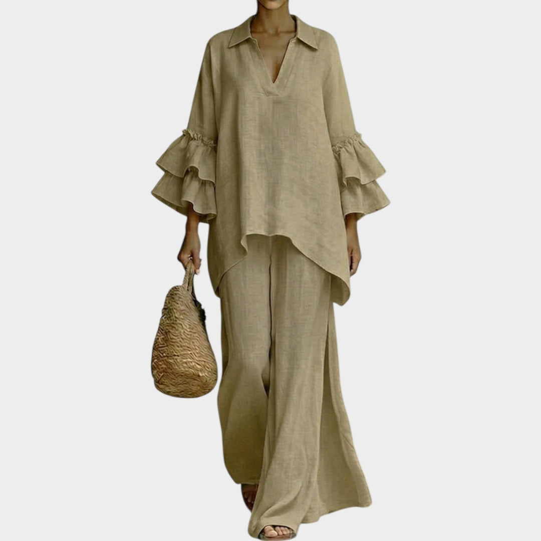 A woman wearing the Ariela oversized top and wide-leg pants two-piece set by Bennett and Lowe, styled casually outdoors.