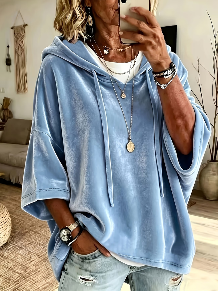 Luana oversized poncho hoodie by Bennett and Lowe displaying a cozy, relaxed fit in soft, neutral fabric with hood and loose sleeves.