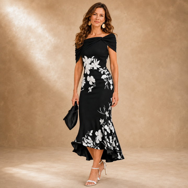 Flora Bennett and Lowe Contour Floral Midi Dress featuring a fitted waist and vibrant floral pattern, displayed on a hanger.
