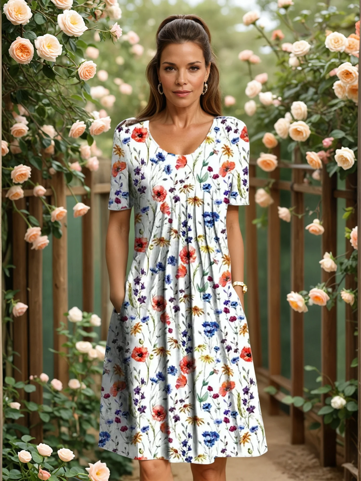 Elegant floral midi dress by Bennett and Lowe, featuring a fitted bodice and flowing skirt with vibrant floral print.