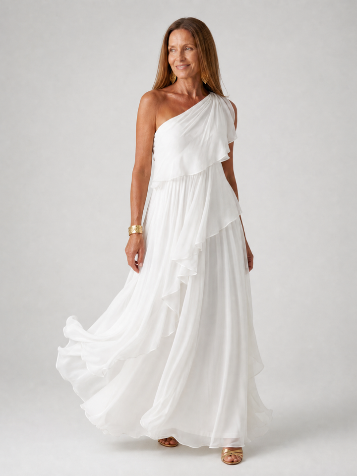 Tracey Bennett and Lowe one-shoulder ruffle maxi dress displayed on a mannequin, featuring flowing fabric and elegant design.