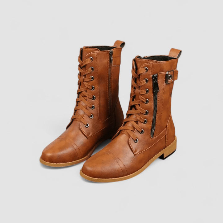 Bennett and Lowe Sylvia lace-up mid-calf women's boots in black leather with chunky heel and decorative stitching.