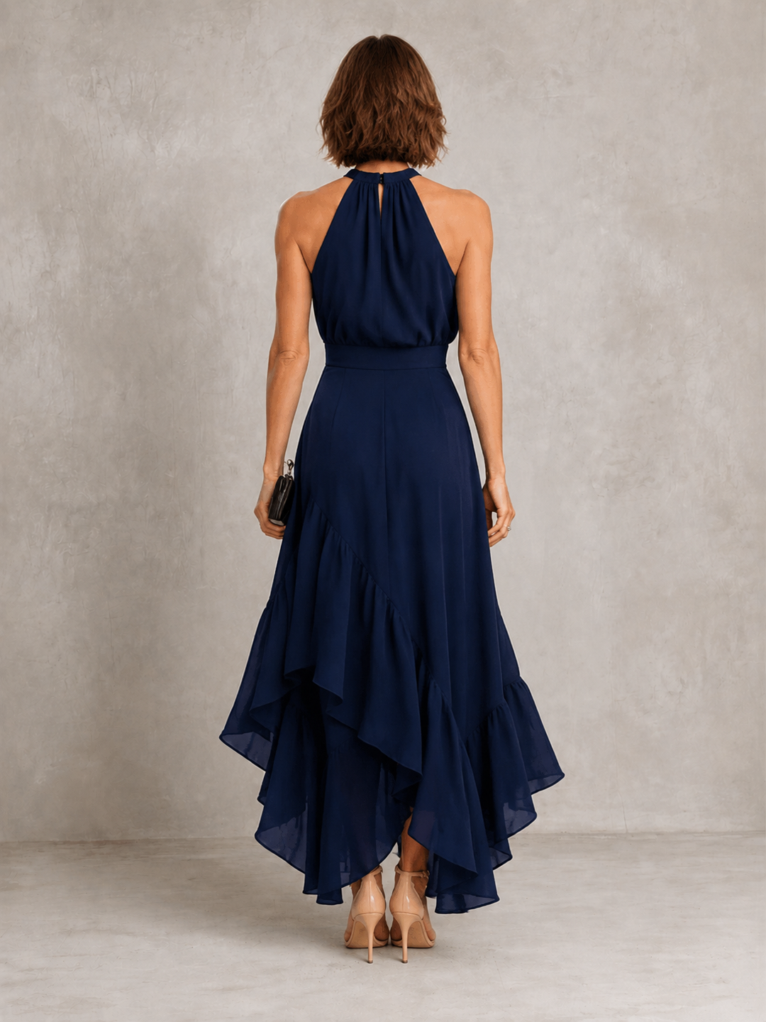 Chloe halter dress with ruffle hem from Bennett and Lowe, featuring a stylish sleeveless design and flowing fabric.