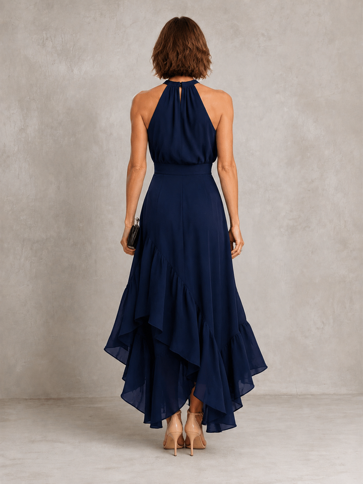 Chloe halter dress with ruffle hem from Bennett and Lowe, featuring a stylish sleeveless design and flowing fabric.