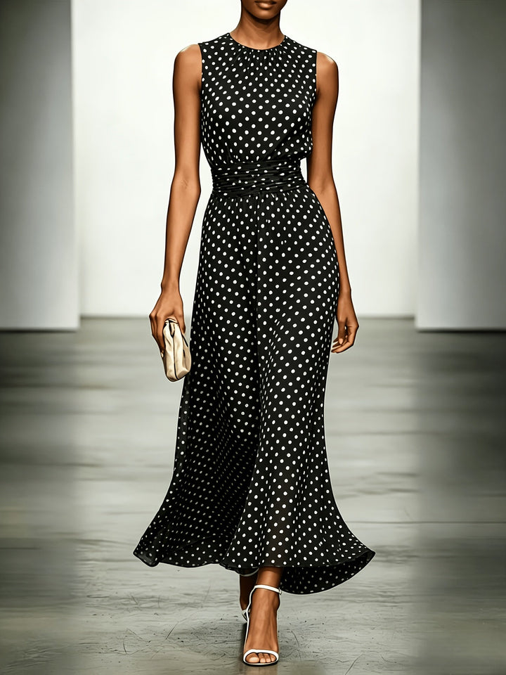 Polka dot maxi dress from Bennett and Lowe featuring a flowing silhouette and sleeveless design.