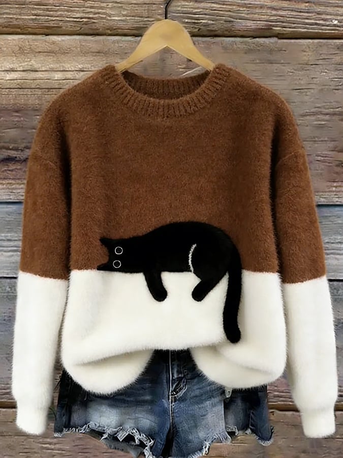 Aileen Bennett and Lowe women's oversized sweater with a playful cat print, cozy knit, and relaxed fit in neutral tones.