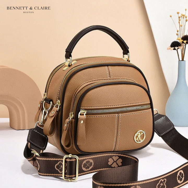 Vivienne compact adjustable crossbody bag by Bennett and Lowe, featuring a sleek design with a long adjustable strap.