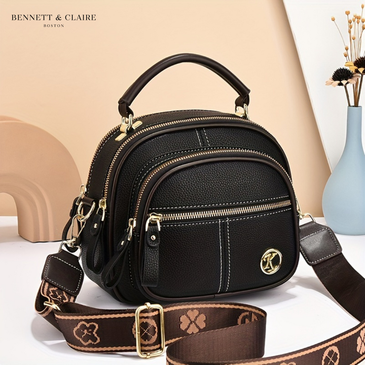 Vivienne compact adjustable crossbody bag by Bennett and Lowe, shown in black with sleek design and adjustable strap.