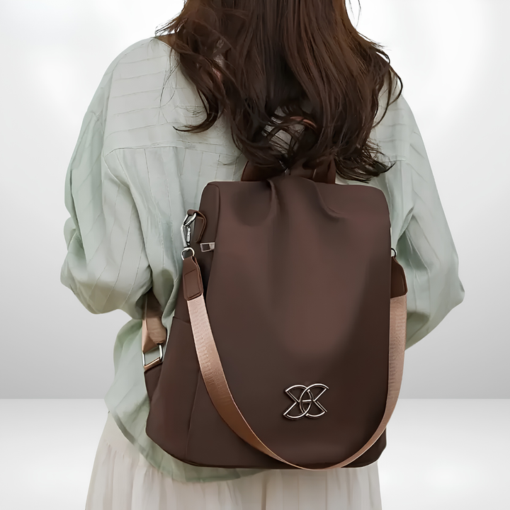Bennett and Lowe Lucius women's multi-compartment anti-theft shoulder bag with secure zippers and adjustable strap.