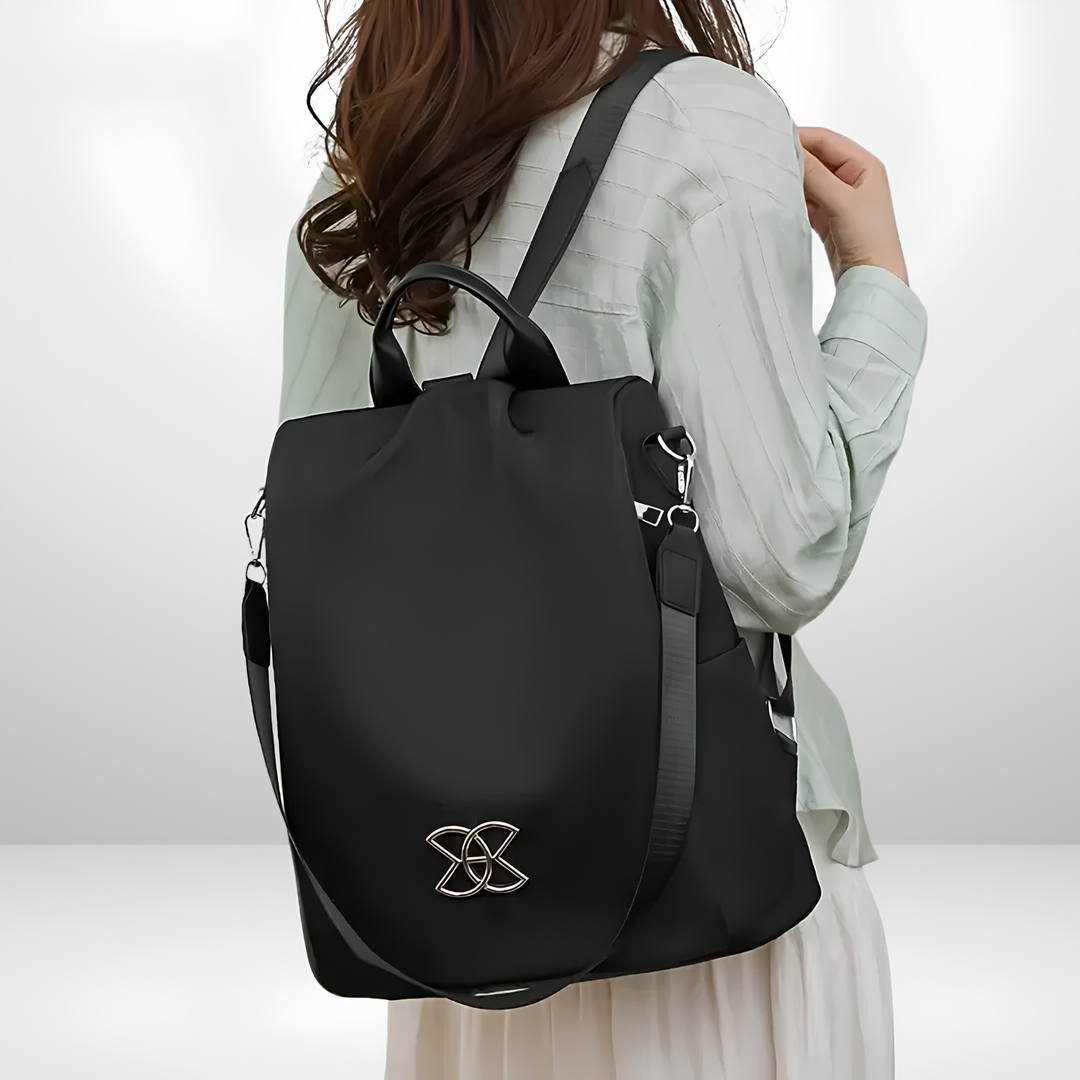 Bennett and Lowe Lucius women's multi-compartment anti-theft shoulder bag with secure zippers and adjustable strap, shown from the side.