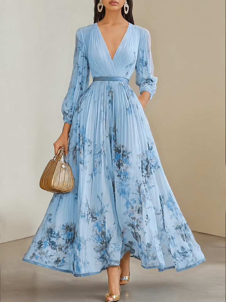 Celeste pleated floral maxi dress for women by Bennett and Lowe, featuring a flowing silhouette and vibrant floral pattern.