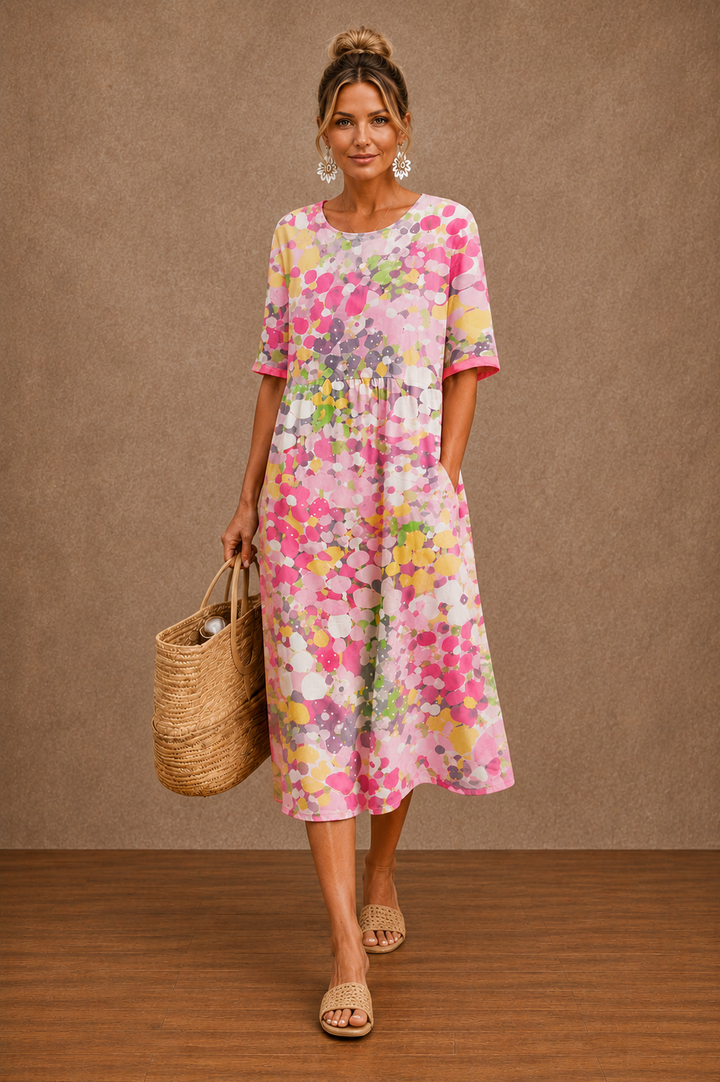 Floral summer midi dress by Bennett and Lowe featuring a lightweight fabric, delicate floral pattern, and a flowing silhouette.