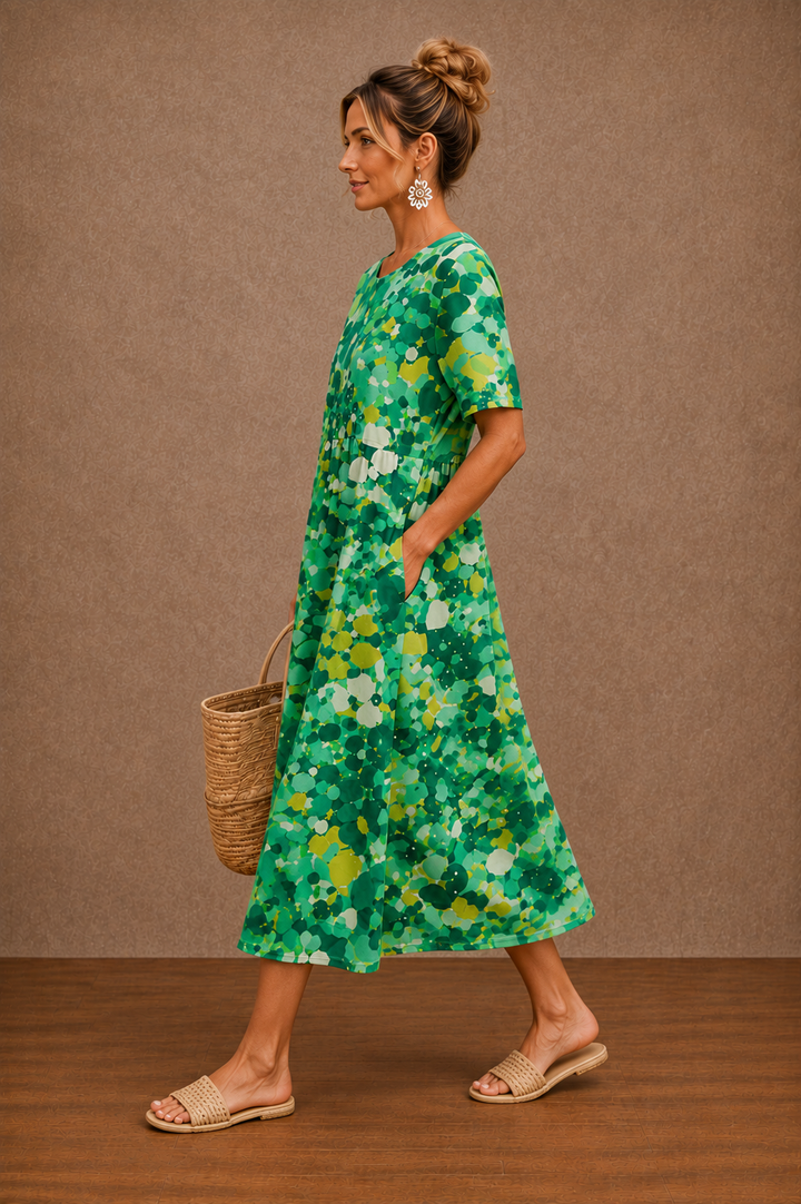 Hazel floral summer midi dress by Bennett and Lowe featuring a lightweight fabric and a fitted waist, perfect for warm weather.