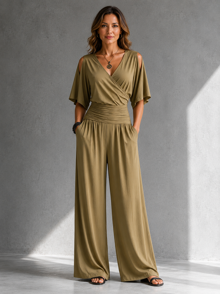Bennett and Lowe Stella wrap V-neck jumpsuit in black, featuring long sleeves and a fitted waist for a chic, modern look.