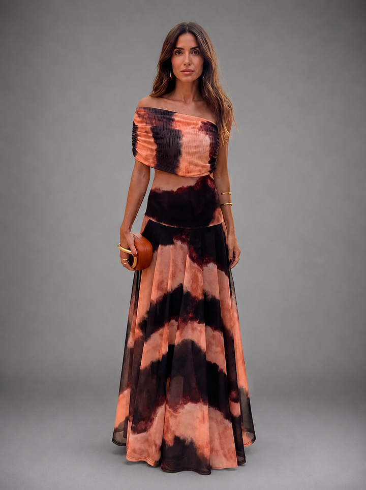Bianca women's maxi dress by Bennett and Lowe with orange and brown floral print, flowing fabric, and V-neck design.
