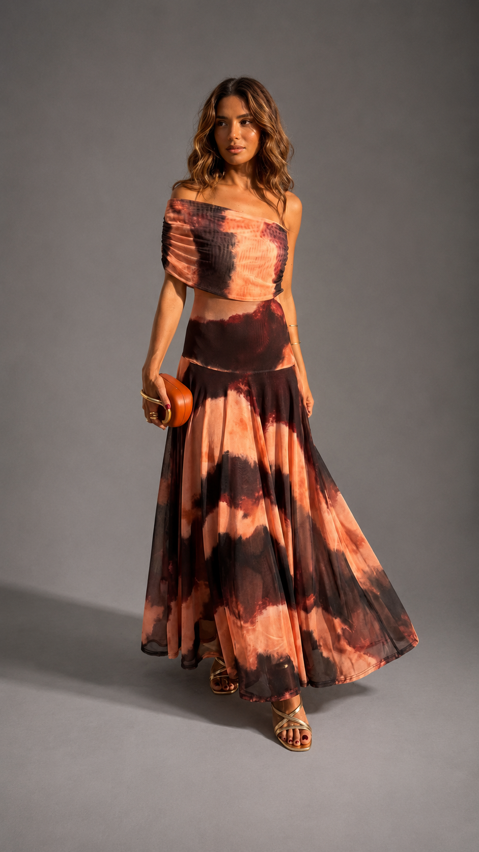 Bianca orange and brown printed maxi dress for women by Bennett and Lowe, flowing fabric with vibrant pattern and sleeveless design.