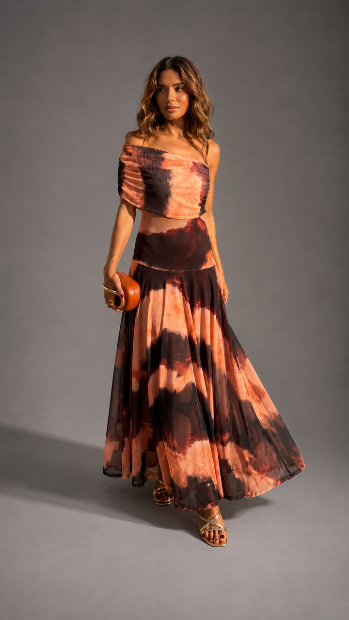 Bianca orange and brown printed maxi dress for women by Bennett and Lowe, flowing fabric with vibrant pattern and sleeveless design.