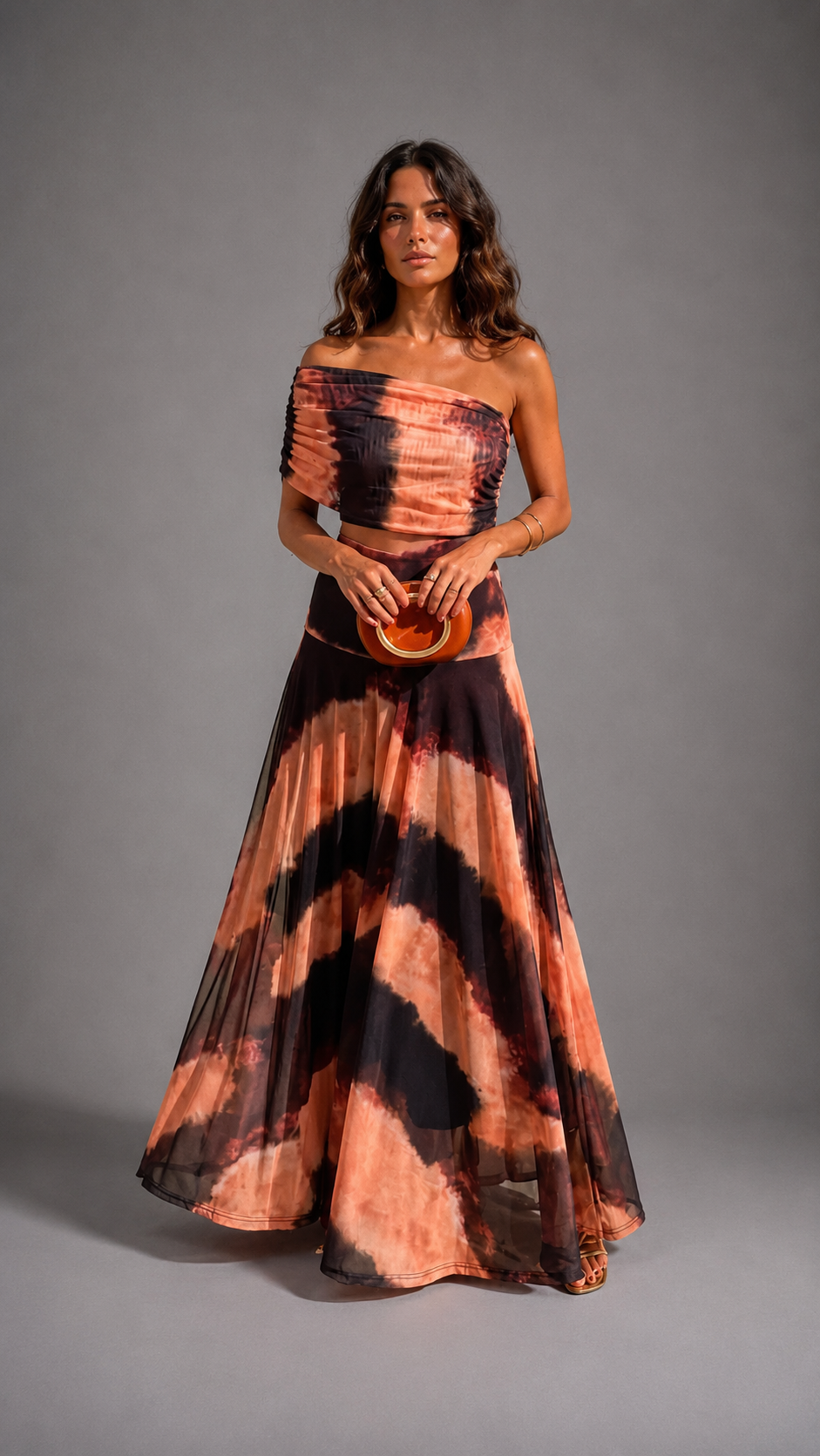 Bianca women's maxi dress by Bennett and Lowe featuring orange and brown print, flowing fabric, and sleeveless design.