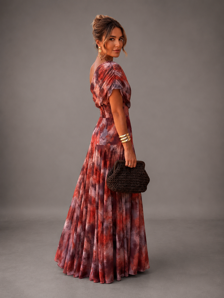 Watercolor off-shoulder maxi dress for women by Bennett and Lowe, with flowing fabric and vibrant floral watercolor pattern.