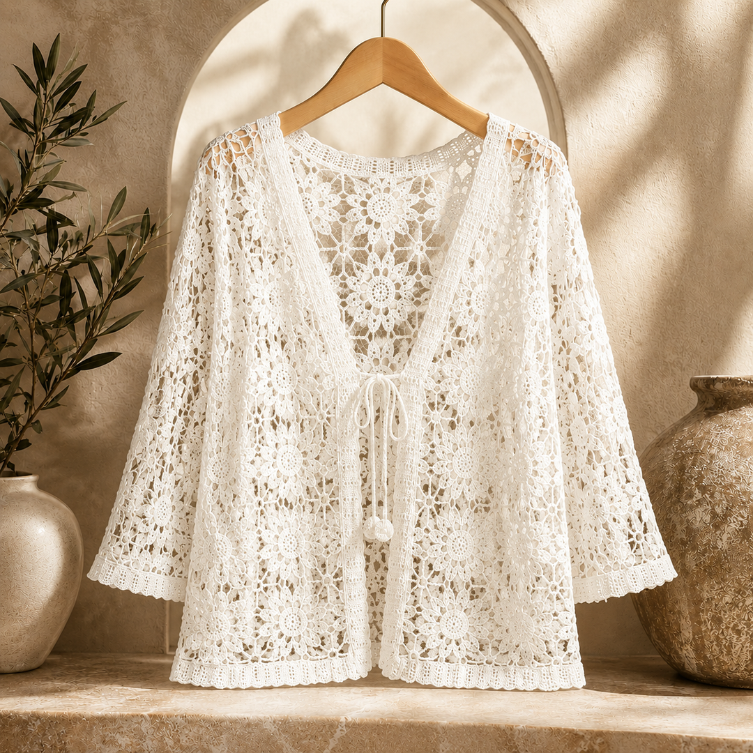 Cream Elora Crochet Cardigan by Bennett and Lowe, showcasing intricate crochet knit pattern and relaxed fit on a mannequin.