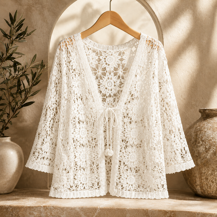 Cream Elora Crochet Cardigan by Bennett and Lowe, showcasing intricate crochet knit pattern and relaxed fit on a mannequin.
