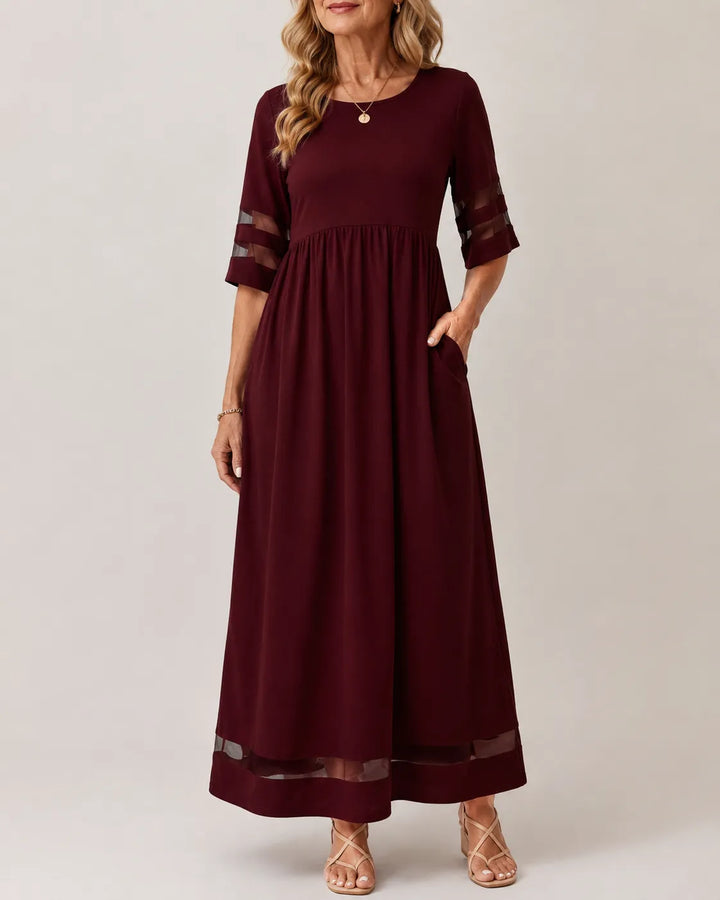Olivia Newyork Country Muse Aubrey Tummy-Smoothing A-Line Midi Dress displayed on a hanger with neutral background.